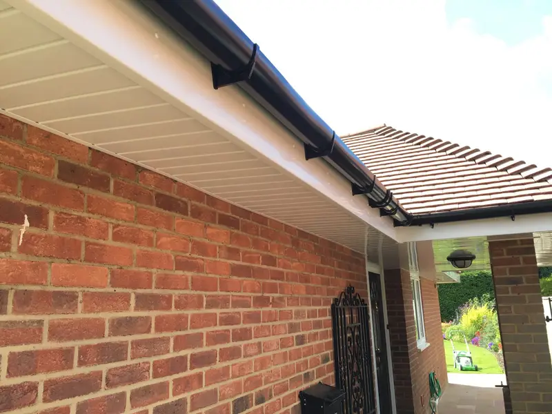 New white fascia and soffit on a brick house
